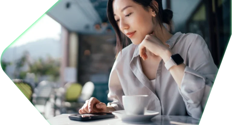 Woman checking phone at coffee shop