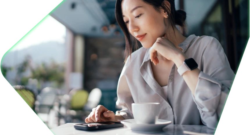 Woman checking phone at coffee shop