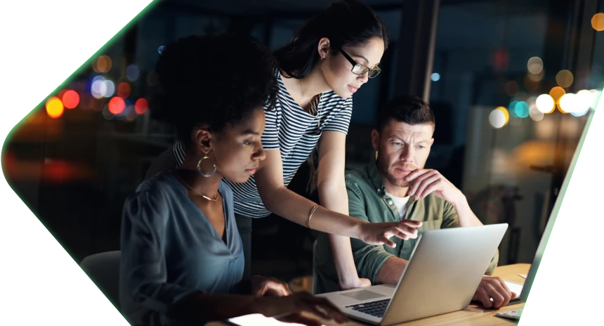 3 colleagues working on a computer