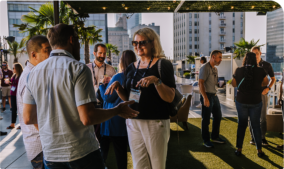 Conference attendees socializing at a networking event